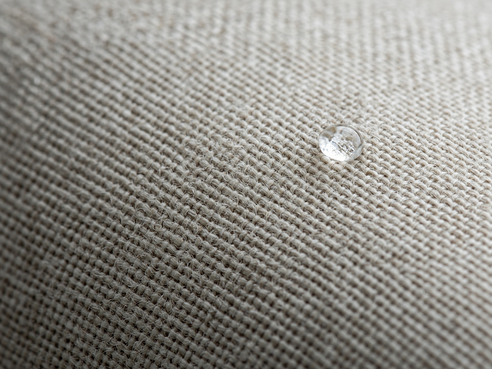 Close-up of clean oatmeal linen upholstery weave